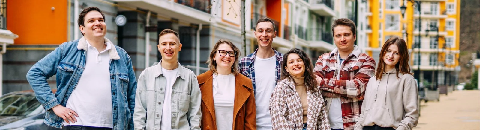 The Wild.Codes team standing together outside on a city street.